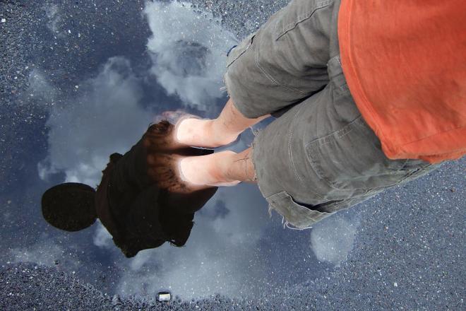 reflection-of-boy-in-a-puddle-of-water-matthias-hauser